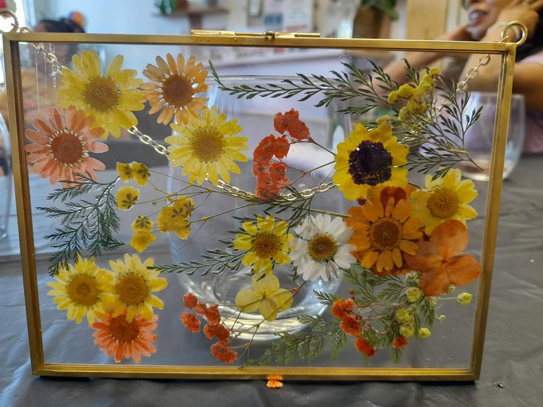 Pressed flowers in frame from an Imagery Estate Winery event