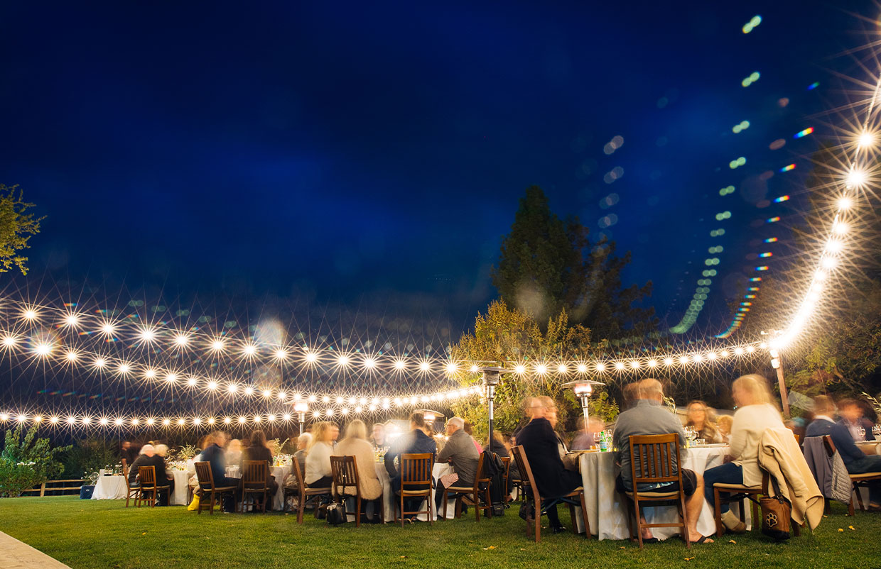 Groups of people seated at tables from a past winery event